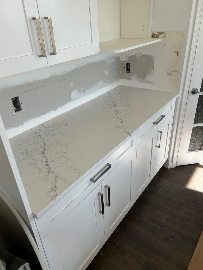 White quartz countertop with grey veining, marble look, Calgary kitchen