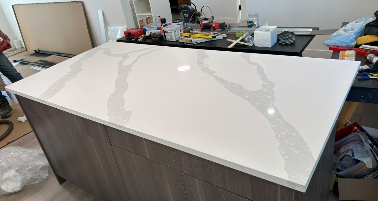 Marble-look quartz kitchen island installed in Calgary by Red Leaf Interior