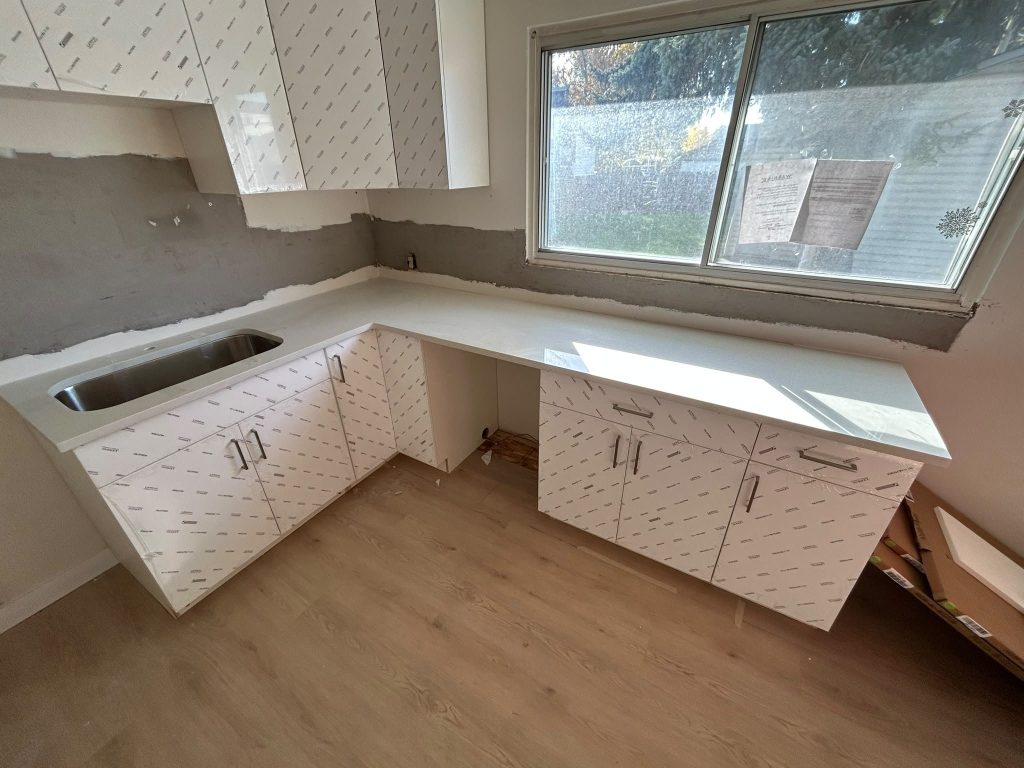 Quartz kitchen countertop installation in progress, Calgary home